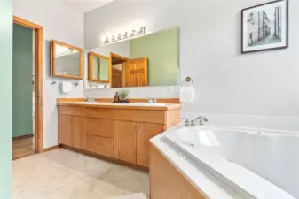 Primary bathroom with double sinks, jetted tub and walk in shower.