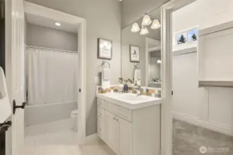 Sink and closet attached to the tan bedroom. Shower/tub and toilet shared by the blue and tan bedrooms.