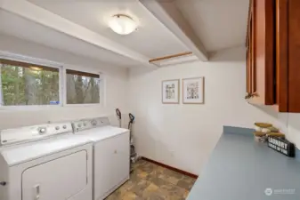 Large well-lit laundry room.