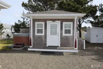 Storage bins surround the studio. Small deck to the side for a nice sitting area or Hot tub. The one shown is not staying.