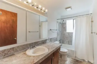 Spacious upper level full guest bathroom, perfect for accommodating your guests.