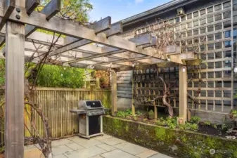 The arbor is stunning and currently the vines are not blooming, but when they are, it is quite lovely to sit beneath, protected as it rains. Magical!