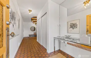 Entryway on lower level. Entrance from driveway directly to main floor, so you don't have to use the spiral staircase
