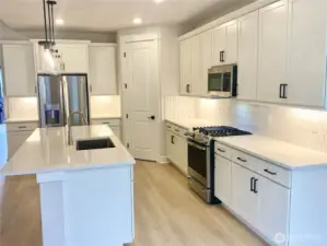 Refrigerator and gas range included