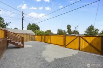 New fenced-in off-street parking spaces (sellers fit two cars including one large truck).