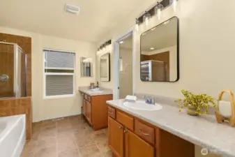 Primary Bathroom Suite with two sinks, tub, and shower.