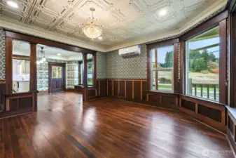 Light spills in all day through the tall windows