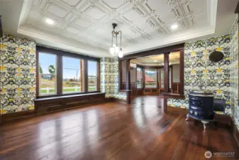 Dining room.  The parlor stove can stay with house at your request.  If it does, owner will build a hearth for it for you and install it.