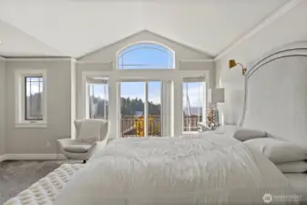 Primary bedroom with a balcony