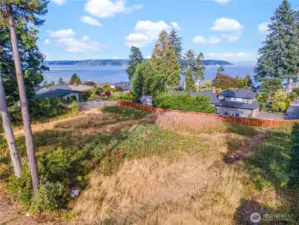 This view lot has sewer, water and gas available.  It is fenced on three sides and can be as private as you'd like.  Here's your opportunity to secure a Gig Harbor lot for your future dreams.