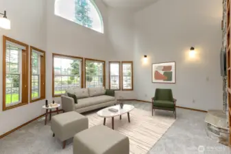 Great Room w/high vaulted ceilings and a wall of windows