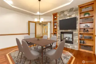Beautiful dining room with Fireplace, trayed ceiling and Built-in shelving for displaying your treasures.