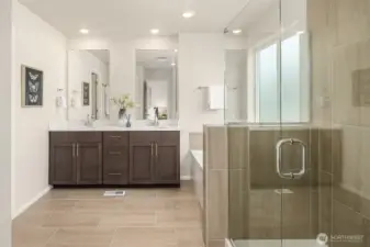 5 piece spa like bathroom off primary bedroom. Opens to walk-in closet and has shower and soaking tub.