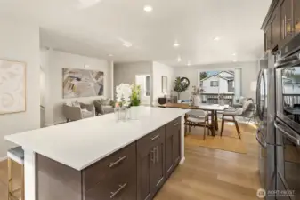 Well designed kitchen with large oversized quartz island with seating for family or friends.