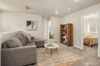 Upper seating area outside the 3 bedrooms on the top level - cozy spot to curl up and read a book or watch a movie.