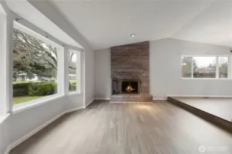 Wood burning fireplace in living room.