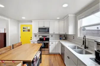 Smart layout with great storage options. Yellow door leads to covered entrance and backyard.