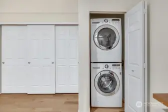 Full sized washer and dryer inside the home.