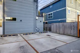 The off-street parking space is easily accessed off the alley. It is the second spot from the right. The gate leads to the pathway to the units.