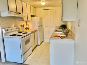 Washer and Dryer are in the closet at the end of the kitchen.