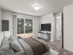 Primary Bedroom with sliding door to back deck virtually staged