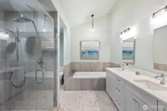 Incredible primary bathroom boasts an oversized walk in shower, jetted tub, double vanity with ample storage and large walk in closet.