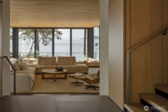 As you enter the primary home you are immediately captivated by the views through the home to the Salish Sea