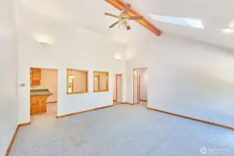 This living room combines open space and rustic charm and is open to the dining room.