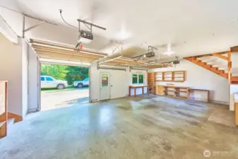 Versatile 704 sq ft studio workspace converted from an attached garage—complete with a large storage area above.