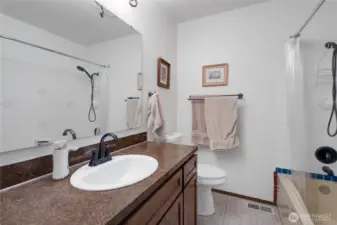 The upstairs full bathroom offers ease for guests or a growing household.