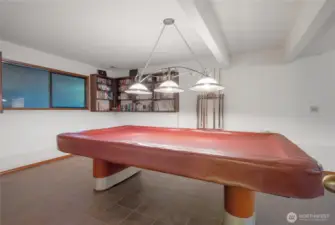 A roomy downstairs rec area with enough space for a full-size pool table—ideal for entertaining.