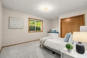 Bedroom or guest quarters on the main floor with adjacent full bathroom.