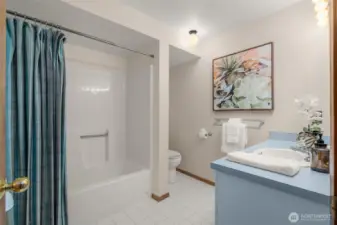 Adjacent to the third bedroom full bath on lower level.