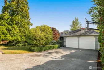 Street view with off street graveled area for extra parking. Basketball hoop stays with home.