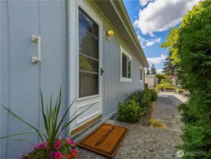 The yard is easy to maintain, yet nicely landscaped for privacy.