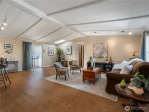 The spacious living room is open and and have vaulted ceilings.