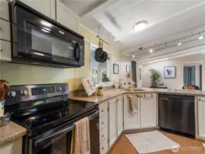 Light and bright. the cook has a view of the guests from just about every angle.