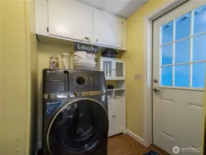 Laundry room conveniently located off the kitchen and access to the carport. Appliances convey with the home.