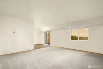 Looking into kitchen eating area and living room.  Fresh paint/carpet through out.
