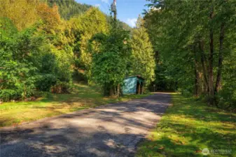 A quiet rural road runs past the cantina. The beginning of Penny Lane, access road for the property, can be seen to the left of the cantina.