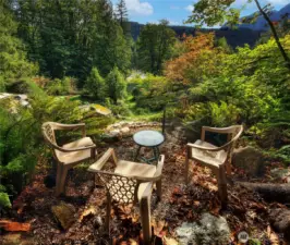 A thoughtfully designed sitting area captures tranquil views of the river and iconic Mount Index.