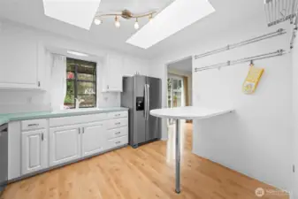 Eat in kitchen with clean white cabinets and stainless appliances~