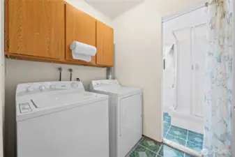 Downstairs laundry that passes through to a 3/4 bathroom