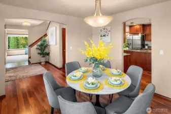 Dining room is connected to foyer and kitchen.