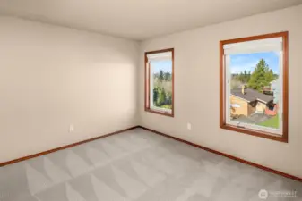 2nd Bedroom offers Milgard casement window, large closet and lush carpet.