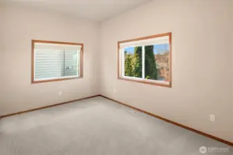 ADU Bedroom offers large walk-in closet, 9' ceilings and lush carpet.