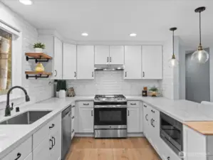 All new cabinets throughout with slab quartz counters and backsplash tiled all the way up.