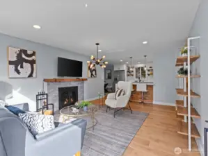 Cozy wood burning fireplace and wide plank flooring greet your guests.