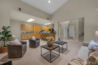 Looking at the kitchen and front door. Notice there is plenty of room for a dining table.