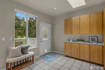 Lots of cabinets overflowing into dining room.